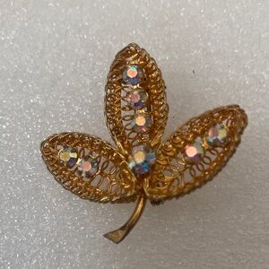 Elegant Gold Leaf Brooch with Iridescent Accents